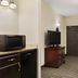 Country Inn & Suites by Radisson, Little Falls, MN room with TV, mini fridge and microwave