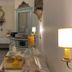 Hotel De La Paix Interlaken breakfast room with buffet table, chandelier, and window view