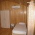 Cirali Almira Bungalow in Cirali: wood-paneled room with single bed, wardrobe, and air conditioner