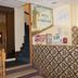 Hotel Les Portes D'Or in Nancy lobby entrance with staircase and patterned front desk