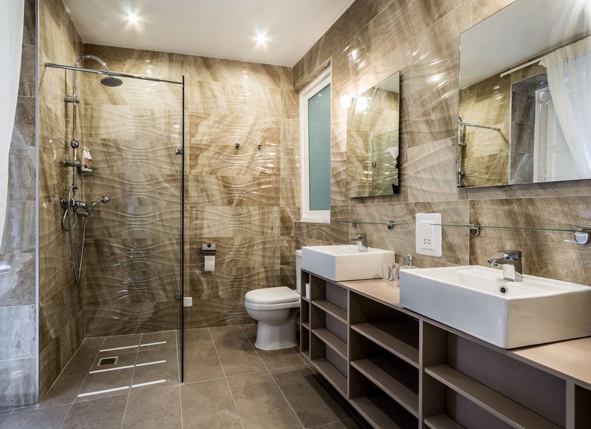 Boco Boutique Hotel in Cospicua bathroom with walk-in shower, toilet, and double sink vanity