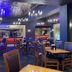 Hollywood Casino Tunica dining room in Tunica Resorts with tables, red booths and blue ambient lighting