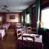 Sporting, Breuil-Cervinia dining room with set tables, wood paneling, and large windows