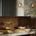 Hotel Belvedere in Kingston breakfast buffet with pastries, fruit, and flowers on a wooden counter