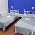 The Dreamers&Co in Córdoba, twin room with two single beds and blue accent wall