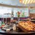 Hôtel Mercure Alger Aéroport breakfast buffet with pastries, bread, coffee dispensers and dining area in Algiers