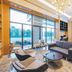 Binhai Jianguo Hotel in Tianjin lobby lounge with floor-to-ceiling windows and seating area
