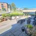 Stord Folkehøgskule Sommarhotell Leirvik outdoor terrace with seating and potted plants in Leirvik