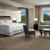 The Westin Reston Heights guest room with king bed, sofa, chairs and large window views in Reston