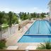 Naples Beach Club, A Four Seasons Resort in Naples with a long outdoor pool and oceanfront-style terrace