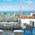 Hilton Hurghada Plaza lounge with sea view, patio seating and oceanfront terrace in Hurghada