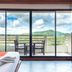 Hua Hin Loft room with balcony, mountain view, and sliding glass doors in Hua Hin