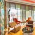 Leonardo Hotel Munich City South lounge with modern seating and bar area in Munich