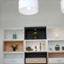 De House Hotel Sibu lobby shelving with decorative plants, vases and pendant lights