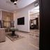Zifan Hotel & Suites in Karachi, living area with sofa, TV, coffee table and marble flooring