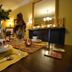 Briarwood Bed & Breakfast in Elmsdale dining room with set table, candles, mirror and fireplace mantel