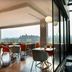 Hilton Garden Inn Mexico City Polanco dining area with city view through large windows