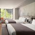 The Sound Hotel Seattle Belltown Tapestry Collection by Hilton guest room with two beds and city-view window in Seattle