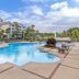 Sheraton Vistana Villages Resort Villas, I-Drive/Orlando pool deck with palm trees in Orlando