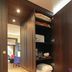 Hotel & Spa Savarin, Rijswijk: open wardrobe with folded towels and a safe beside a vanity mirror