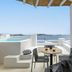 Rocabella Mykonos Hotel in Agios Stefanos: terrace with table, chairs and sea view