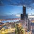 Ct Theme Suite in Kaohsiung City skyline view at dusk with illuminated high-rise buildings and waterfront