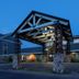 Black Beach Inn by GrandStay in Silver Bay exterior with covered entrance at dusk