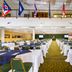 River Terrace Resort & Convention Center in Gatlinburg conference hall with rows of banquet tables and flags