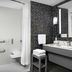 Homewood Suites by Hilton Huntsville-Village of Providence bathroom with roll-in shower and vanity