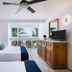 Hotel Villa Varadero in Nuevo Vallarta guest room with twin beds, TV and ocean-view balcony