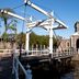 Golden Tulip Leiden Centre in Leiden with a historic drawbridge and canal beside a domed brick gate