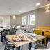 B&B HOTEL Calais Centre St Pierre breakfast room in Calais with tables, chairs and buffet area
