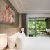 Pp Princess Resort Ko Phi Phi guest room with king bed and balcony overlooking greenery