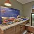Holiday Inn Express & Suites Albuquerque-N. Balloon Fsta Pk breakfast station with toaster and pastries in Albuquerque