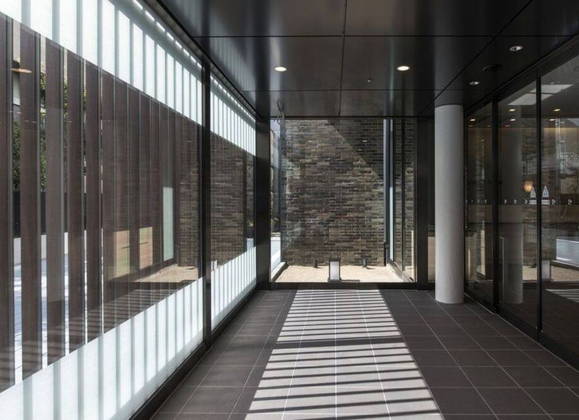 karaksa hotel Osaka Namba hallway with glass walls and striped light in Osaka