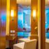 Shangri-La Baotou guest room vanity area with mirrored panel, wall sconces and seating