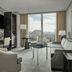 Four Seasons Hotel One Dalton Street, Boston suite with city views, seating area and desk by large windows