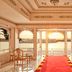 Taj Fateh Prakash Palace Udaipur lobby with red carpet and lake views through arched windows