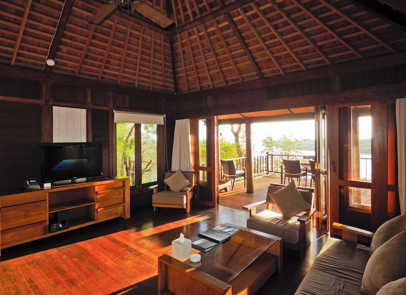 The Menjangan by LifestyleRetreats villa interior with open deck and forest view in Gerokgak