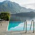 Filario Hotel & Residences in Lezzeno with lakefront pool, loungers, and mountain views
