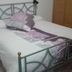 Casa Siciliana Altarbiah in Trabia: bedroom with metal bed frame, white bedding, and wooden wardrobe