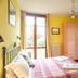 Agriturismo Il Cavicchio, Pianoro: bright guest room with bed, wardrobe, desk, and balcony door