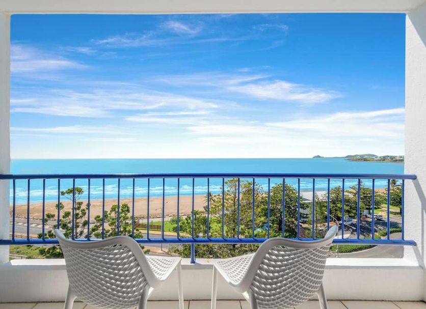 Bayview Tower Yeppoon balcony with chairs and ocean and beach view