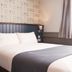Corner House Inn by Greene King Inns bedroom with double bed and window in Newcastle upon Tyne