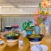 Pace Hotel Suzhou Renmin Road buffet counter with salads, flowers and serving dishes in Suzhou