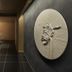 Onsen Ryokan Yuen Shinjuku in Tokyo hallway with dark tile floor and circular wall art