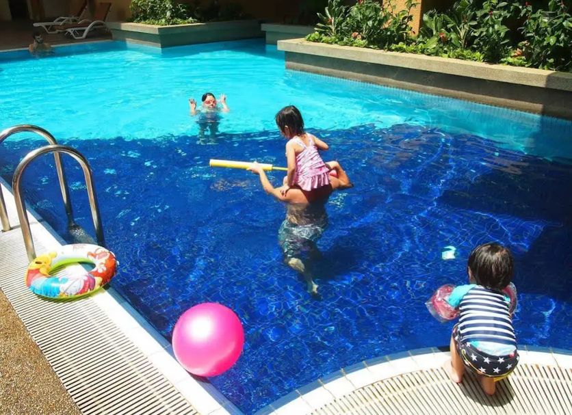 Seri Bukit Ceylon Suites Bukit Bintang pool in Kuala Lumpur with children playing in the water