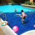 Seri Bukit Ceylon Suites Bukit Bintang pool in Kuala Lumpur with children playing in the water