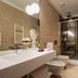 WorldHotel Casati 18 Milan modern hotel bathroom with double vanity, toilet and glass shower