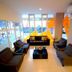 High Point Surabaya lobby lounge with sofas, chairs, coffee table and large windows